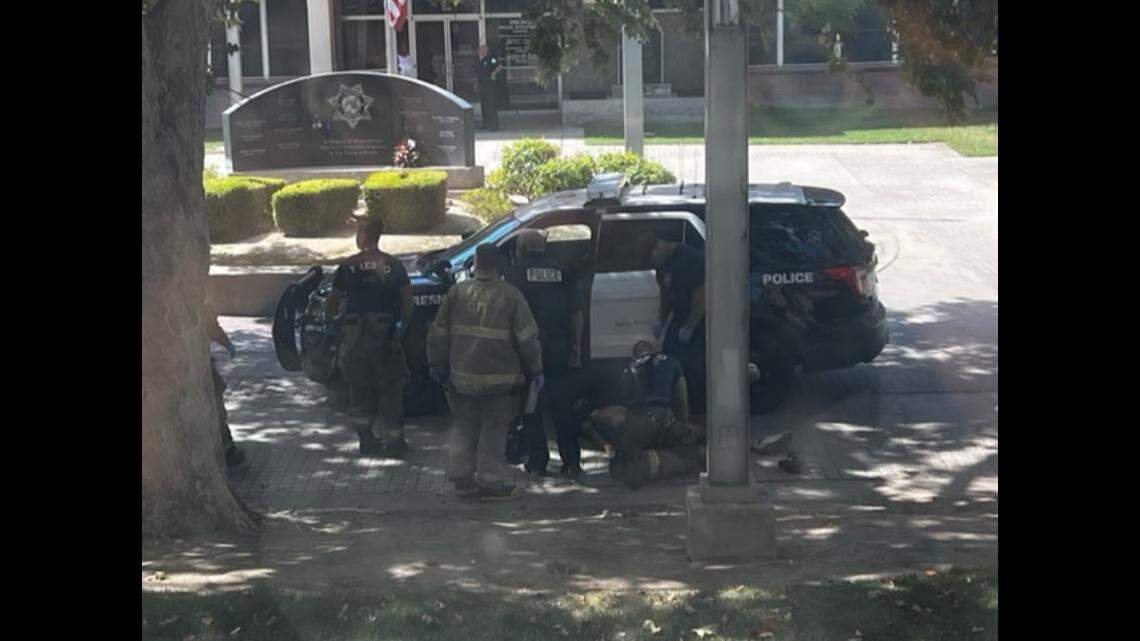 Advocates say an police officer driving on the walkway outside of the Fresno Police Department ran over a homeless man sleeping on the ground on Aug. 1, 2022.