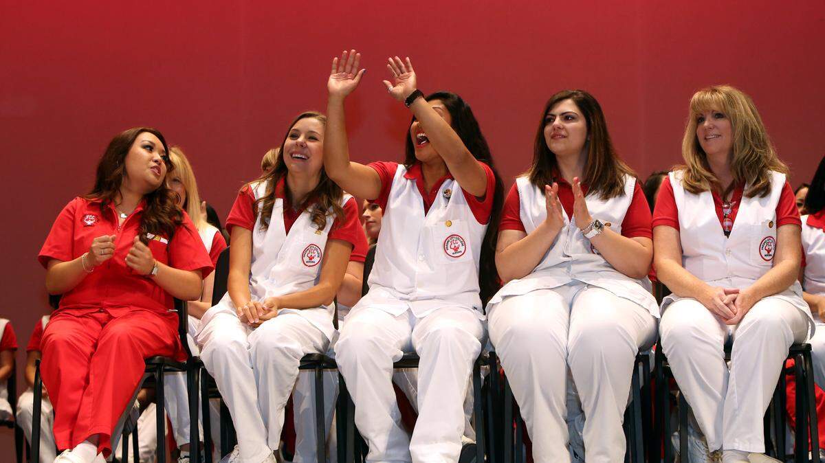 Graduates prepare for the pinning ceremony of the Fresno City College Registered Nursing Program at the Roosevelt High School auditorium in May 2014.