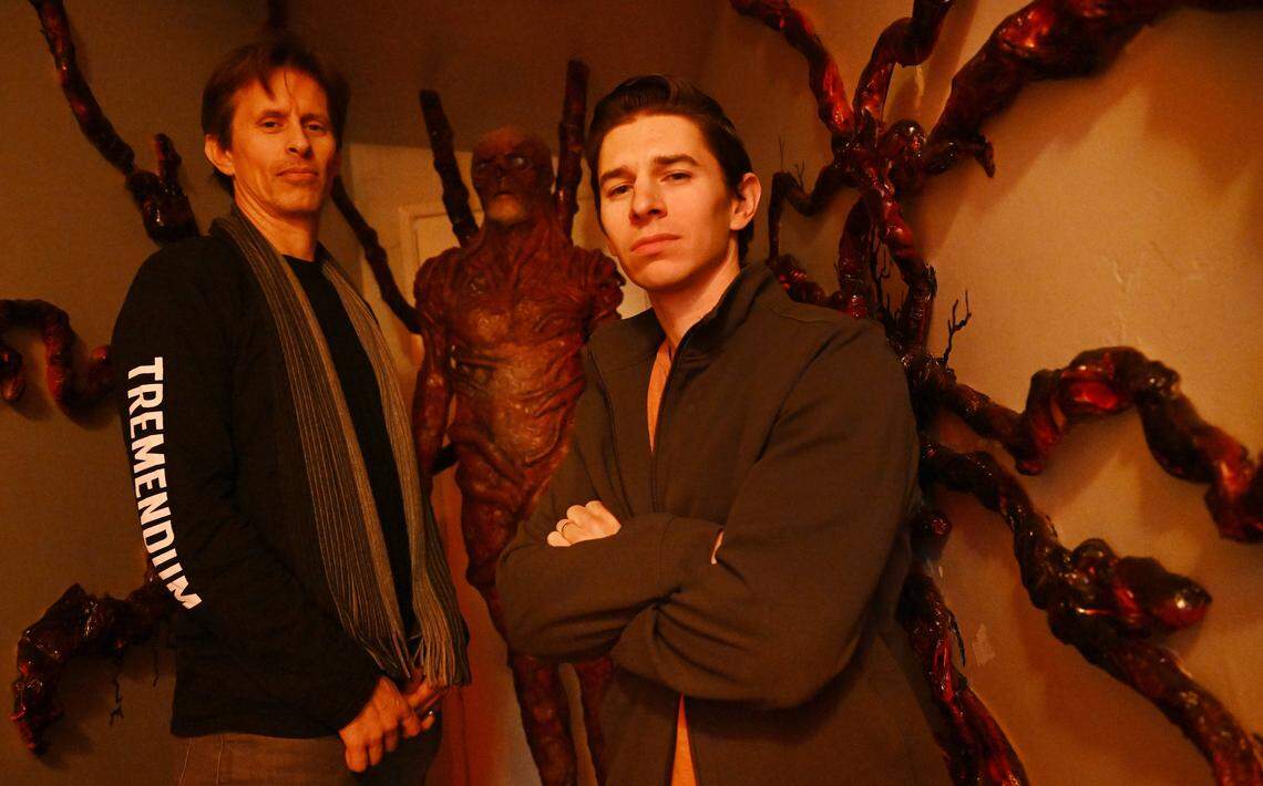 Travis Cluff, left, and Chris Lofing, right, pose in front of the Vecna, part of the Stranger Things-themed attractions in their Clovis Airbnb house. Photographed Tuesday, Jan. 13, 2026 in Clovis.