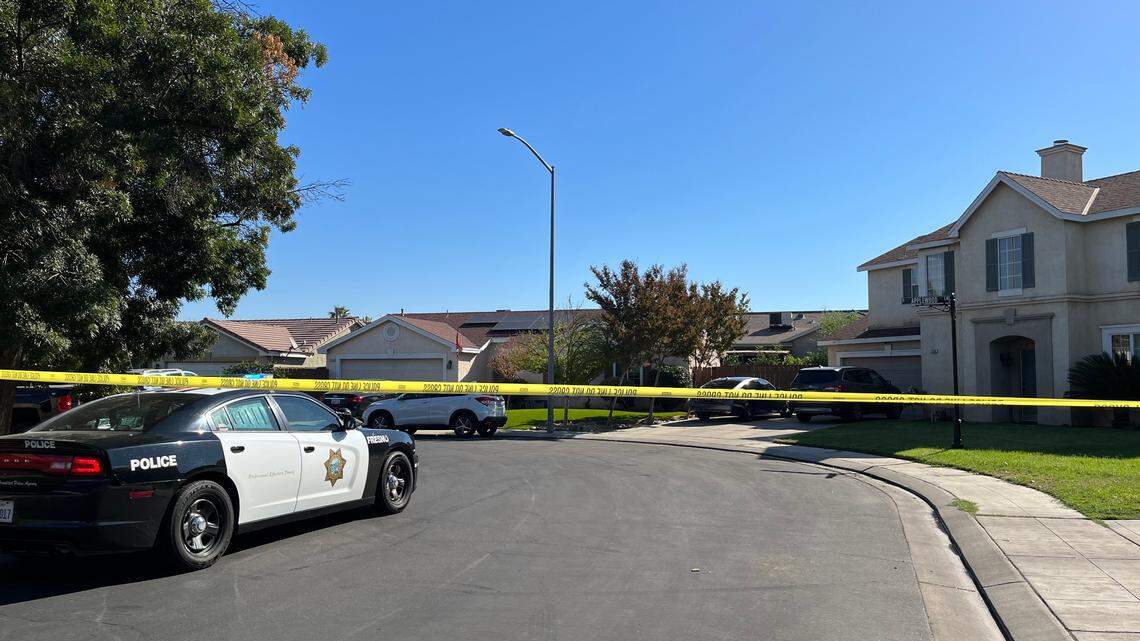 Fresno police blocked off East Harvest Lane as SWAT officers negotiated with someone in a home on the morning of Sunday, Sept. 25, 2022.