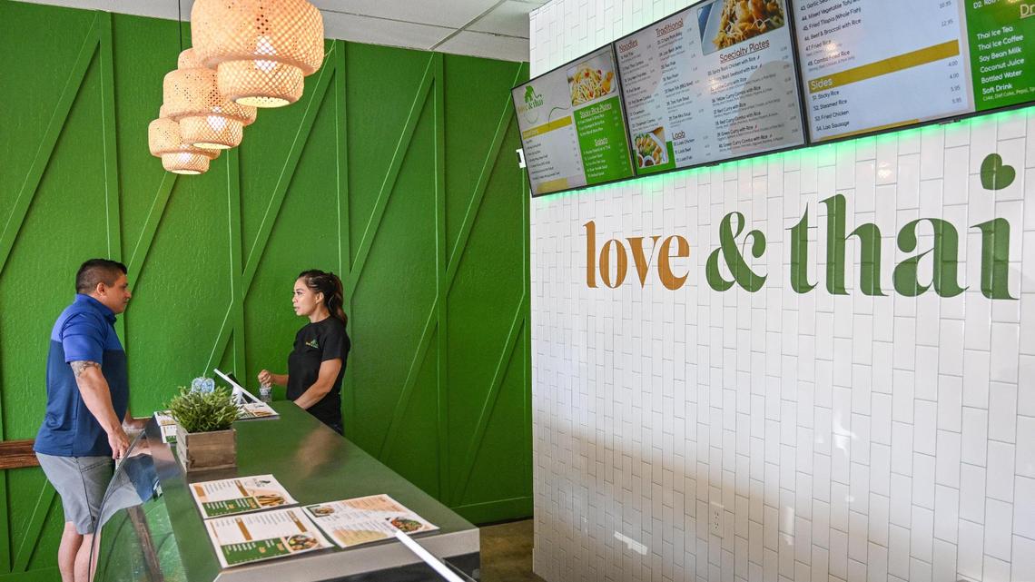 A customer gives his order at Love & Thai, a Lao and Thai food restaurant, formerly Tasty Thai, before it was closed after false allegations of using dog meat online. The new restaurant is opening in the shopping center at South Chestnut and East Butler avenues in southeast Fresno.