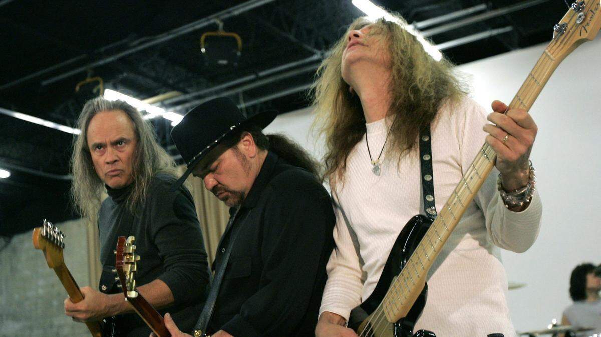 In this Friday, Feb. 4, 2005, file photo, members of Lynyrd Skynyrd, from left, Rickey Medlocke, Gary Rossington and Ean Evans, practice at the Jacksonville Production Studio in Jacksonville, Fla.