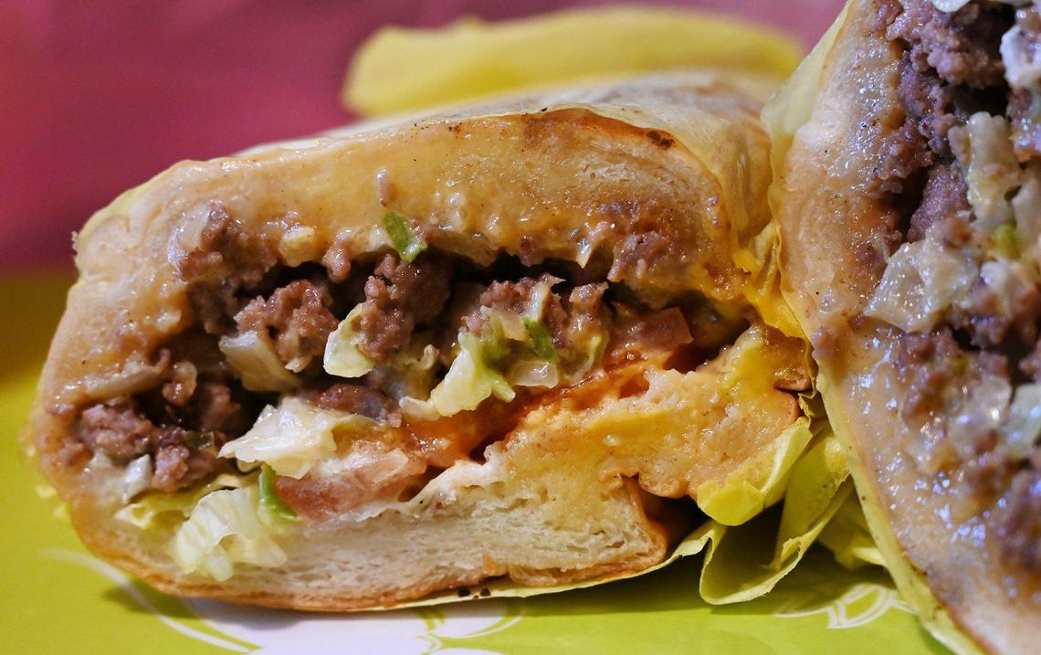 Eddie Wutangsy’s Classic NY Chopped Cheese sandwich featuring seasoned Andalusian ground beef, two slices of American cheese, shredded lettuce, tomato and fresh onion topped with ketchup and mayonnaise, available at his My Guy Market on Belmont Avenue just north of downtown. Photographed Friday, Jan. 20, 2023 in Fresno.