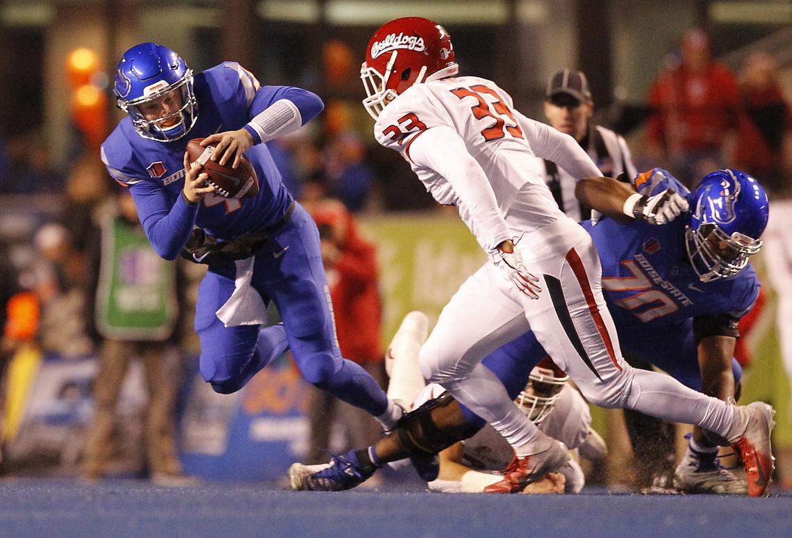 Fresno State defensive end Kwami Jones (33) closes in on Boise State quarterback Brett Rypien (4) in the Bulldogs 24-17 loss to the Broncos last season.  