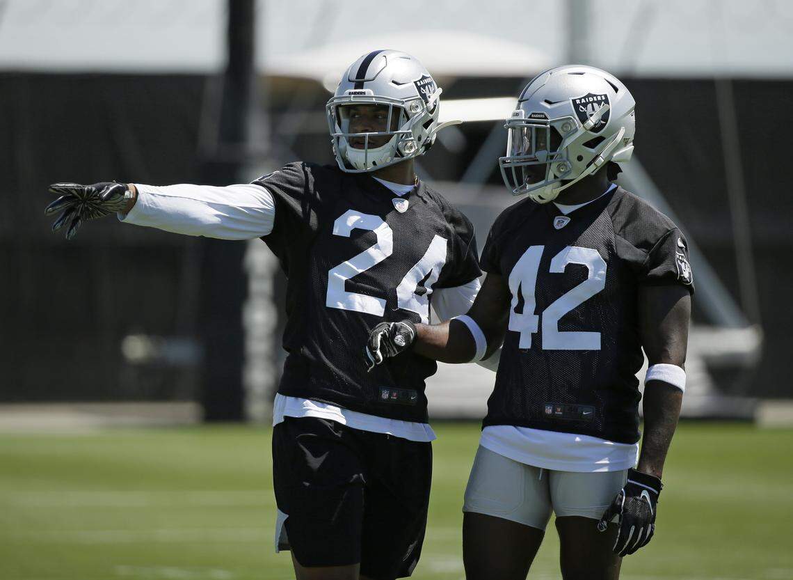 Oakland Raiders defensive back Johnathan Abram (24) and safety Karl Joseph (42) take part in a drill during NFL football minicamp Tuesday, June 11, 2019, in Alameda, Calif.