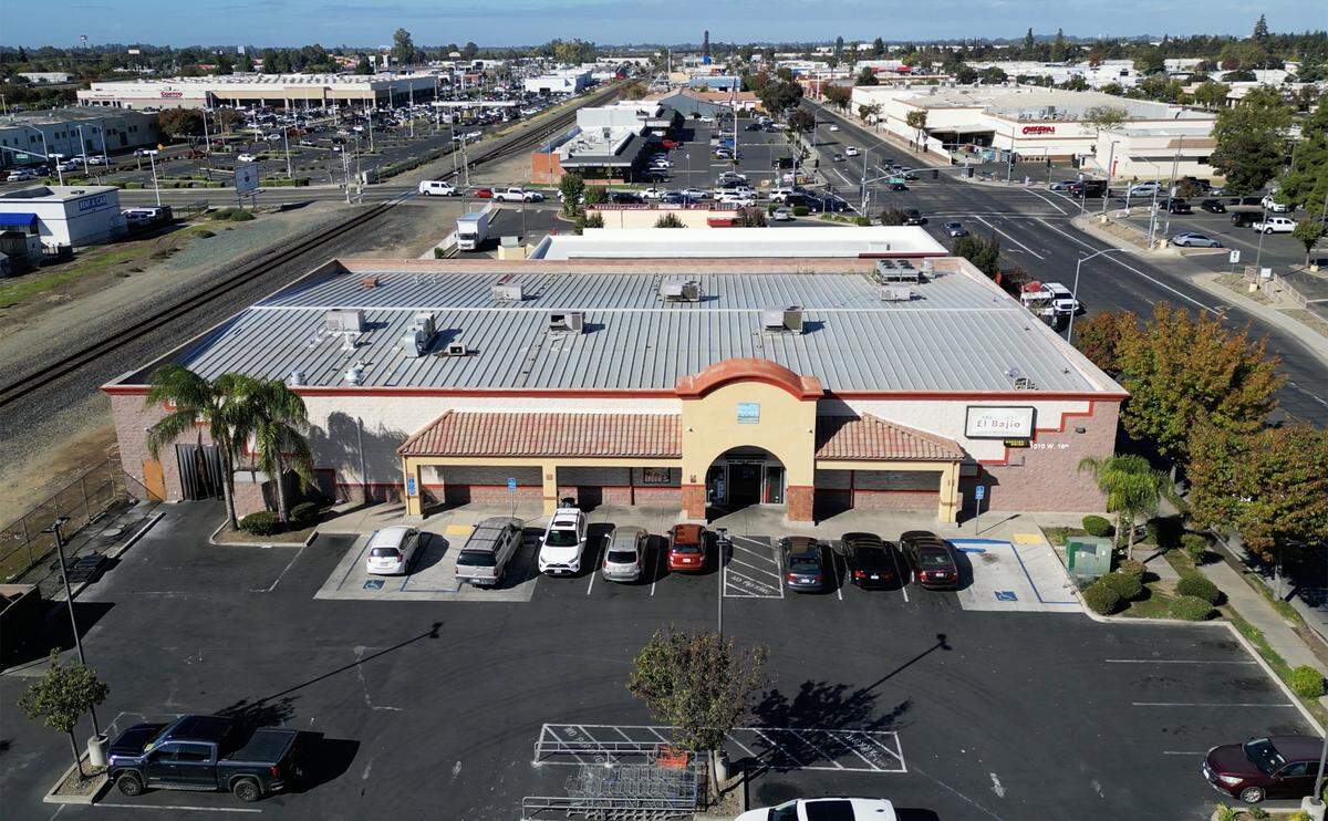 Fernando Rodriguez said his family has invested millions into relocating their El Bajio Supermarket, seen located between the train tracks, left, and 16th Street, right, in Merced, to another location but now the California High Speed Rail Authority wants to change plans and skirt around the city. Photographed Friday, Nov. 7, 2025 in Merced.