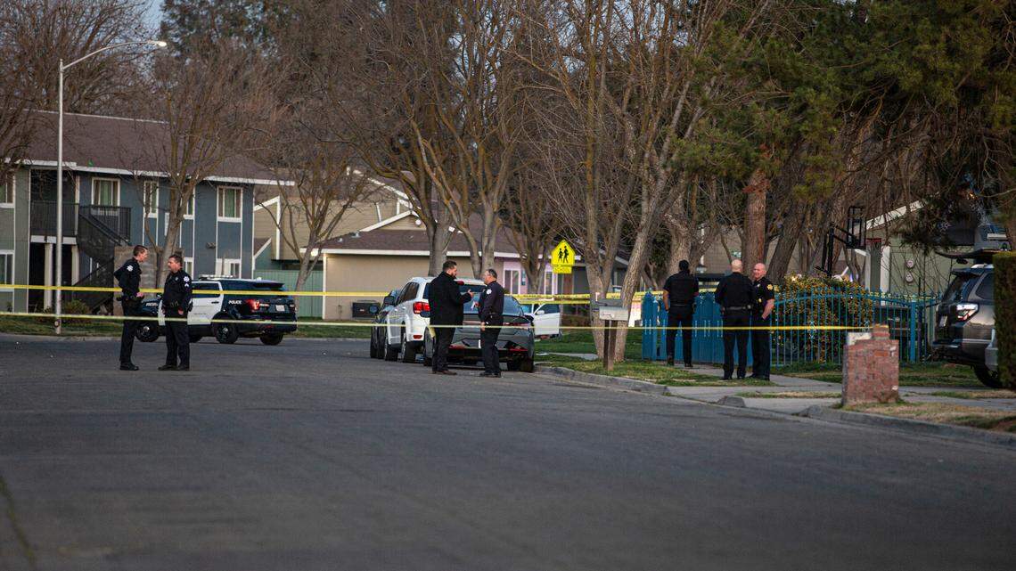 Police tape of the street as they investigate a shooting that left a woman shot eight times in a southwest Fresno neighborhood on Monday, Feb. 28, 2022.