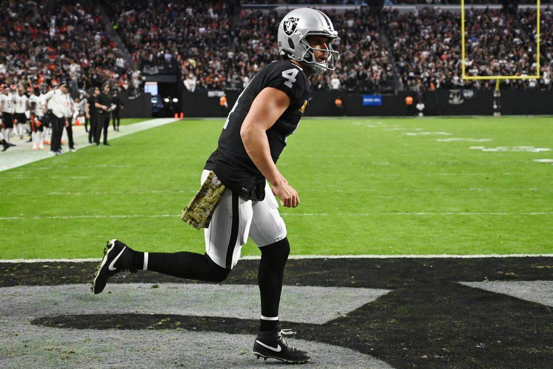 Las Vegas Raiders quarterback Derek Carr (4) celebrates after the Raiders scored a touchdown against the Cincinnati Bengals during the second half of an NFL football game, Sunday, Nov. 21, 2021, in Las Vegas.