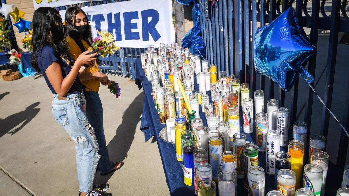 Students gather at Sunnyside High School to light candles during a vigil to give those who knew Principal Tim Liles a chance to share memories and gather in mourning on Wednesday, Sept. 23, 2020. Liles died of brain cancer on Tuesday.