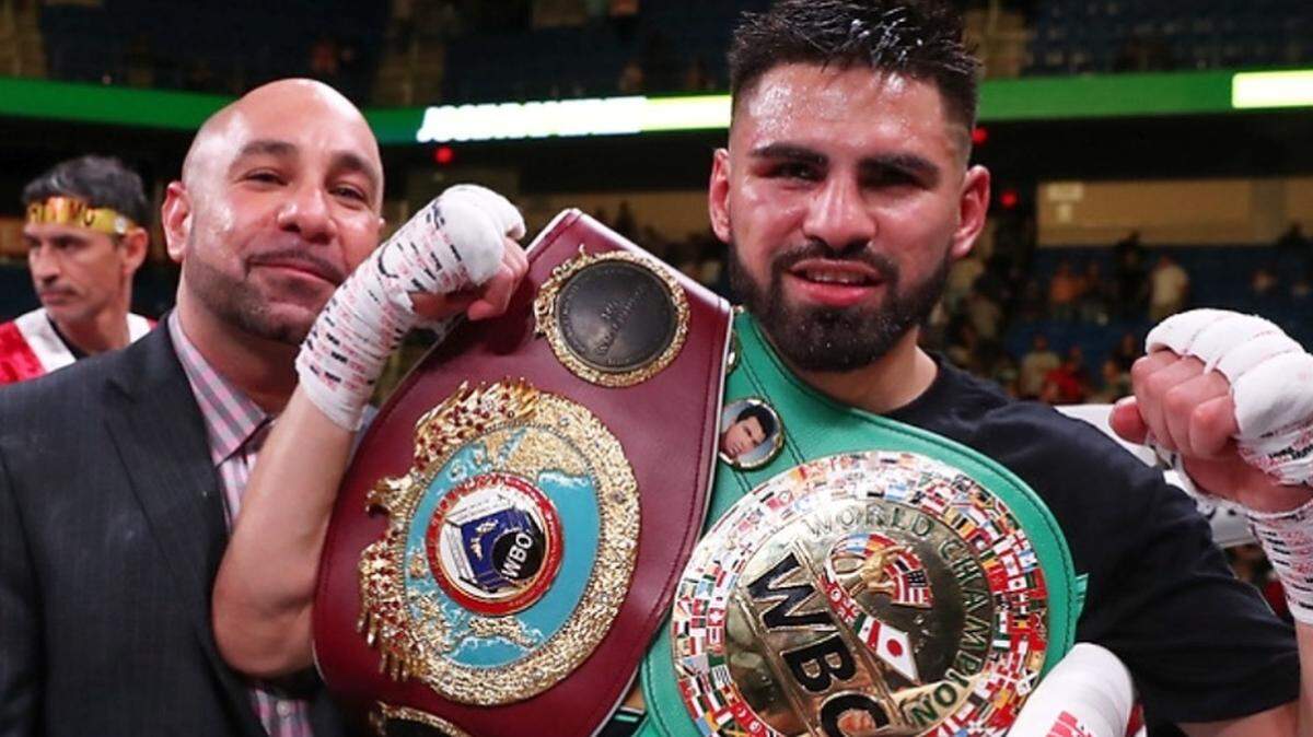WBC and WBO super lightweight world champion Jose Ramirez, right, celebrates his July 29, 2019, victory over Maurice Hooker in Arlington, Texas, with longtime agent/promoter Rick Mirigian. The two have been together since Ramirez’s days as an amateur boxer.
