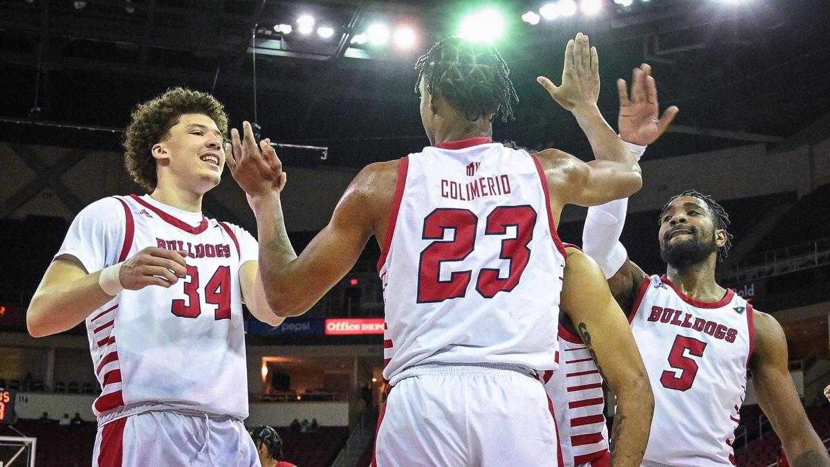 Fresno State’s Leo Colimerio is congratulated by teammates Braxton Meah, left, and Jordan Campbell, right, after picking up a foul against Youngstown State during their quarterfinal game in the 2022 Basketball Classic tournament at the Save Mart Center in Fresno on Wednesday, March 23, 2022.