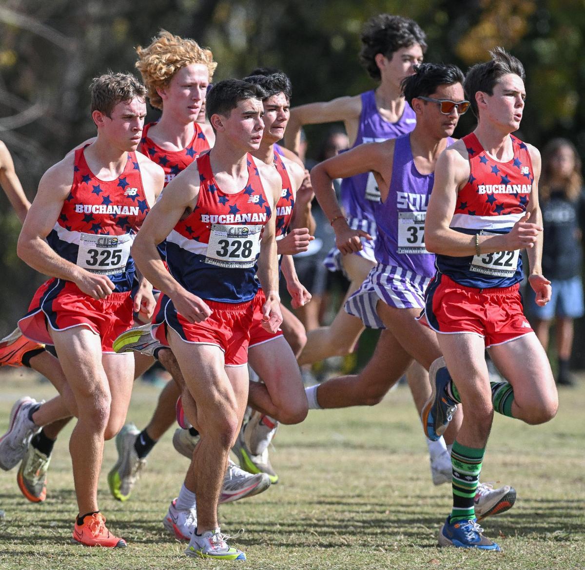 The Buchanan boys cross country team run together off the start of the Central Section boys Division 1 championship cross country race at Woodward Park on Thursday, Nov. 16, 2023. The Bears finished second overall.