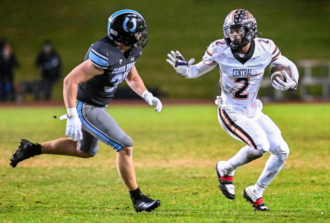 Central’s Brandon Smith, right, tries to get around Clovis North’s Aiden Barnett during their Central Section Division 1-AA semifinal game at Veterans Memorial Stadium in Clovis on Friday, Nov. 15, 2024.
