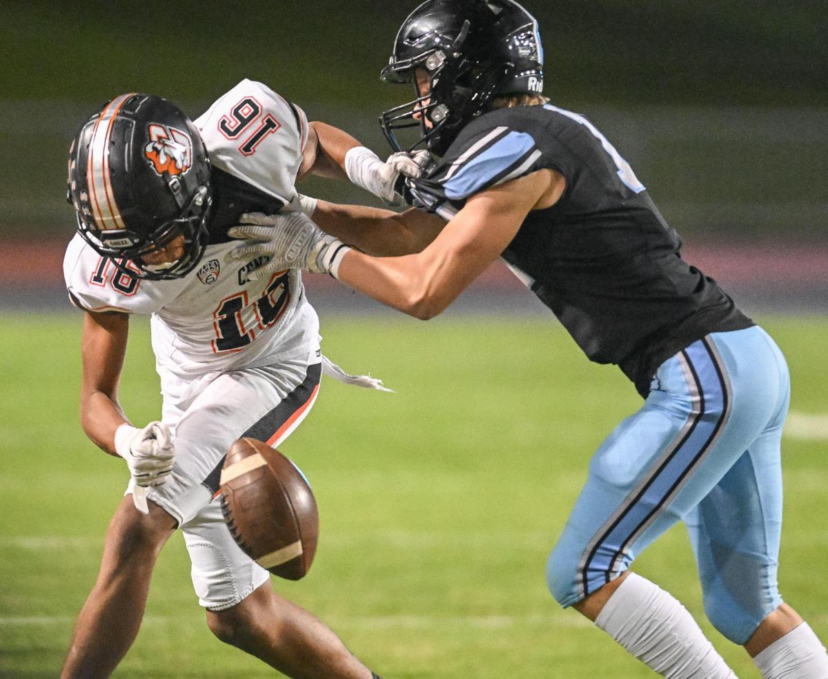 Clovis North’s Trent Rogers, right, breaks up a pass attempt to Central’s Zeb White in their Tri-River Athletic Conference football final at Veterans Memorial Stadium on Thursday, Oct. 26, 2023.