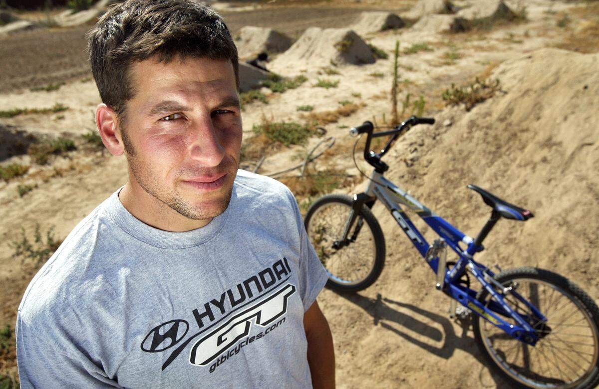Randy Stumpfhauser, seen here at the height of his career in 2005, stands in the dirt bike track he built four and a half years ago at his Sanger home. Stumpfhauser is being inducted into the BMX Hall of Fame. 