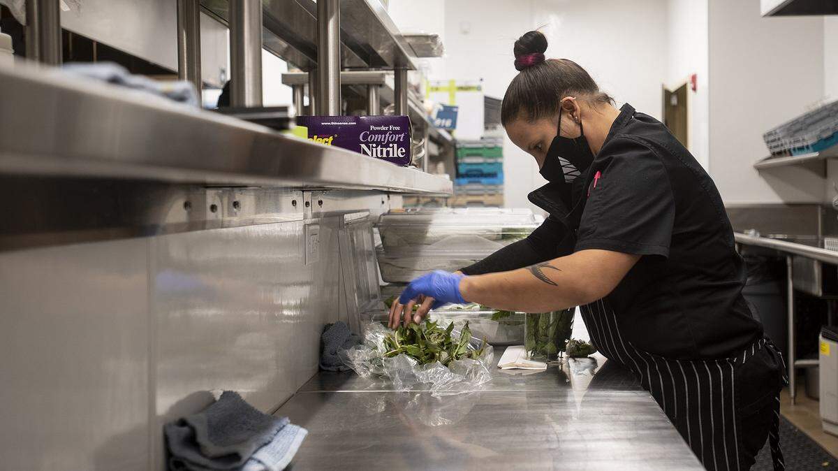 Shelly Chavez, 40, of Merced, is shown working her job as a prep cook in the kitchen at the Mainzer in Merced, Calif. County leaders say the local labor force is 2,400 workers away from returning to the “best economy” in recent times.