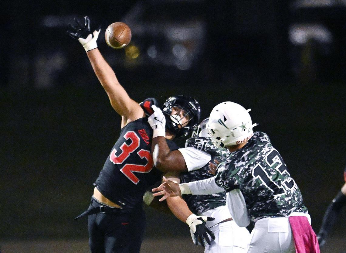 McLane’s Juan Raygoza tries to block Hoover quarterback Cam Mobley’s throw Friday, Nov. 1, 2024 in Fresno.