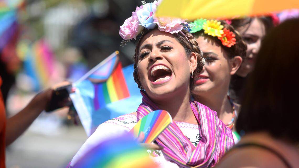 A Fresno Rainbow Pride Parade participant shouts during the event in the Tower District on June 3, 2023.