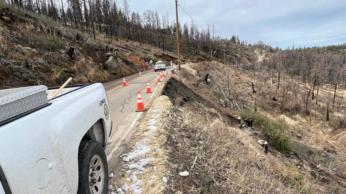 Fresno County officials released this photo showing county trucks making a precarious journey on the Auberry Road.