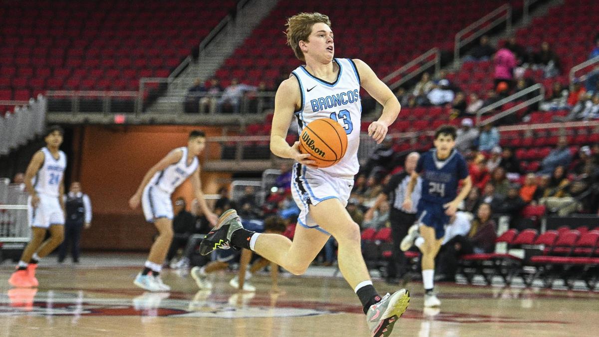 Clovis North’s Max Landon charges downcourt on a fast break before scoring against Bullard in the championship game of Valley Children’s Tip-Off Invitational at the Save Mart Center on Saturday, Dec. 3, 2022. Clovis North defeated Bullard 75-54.