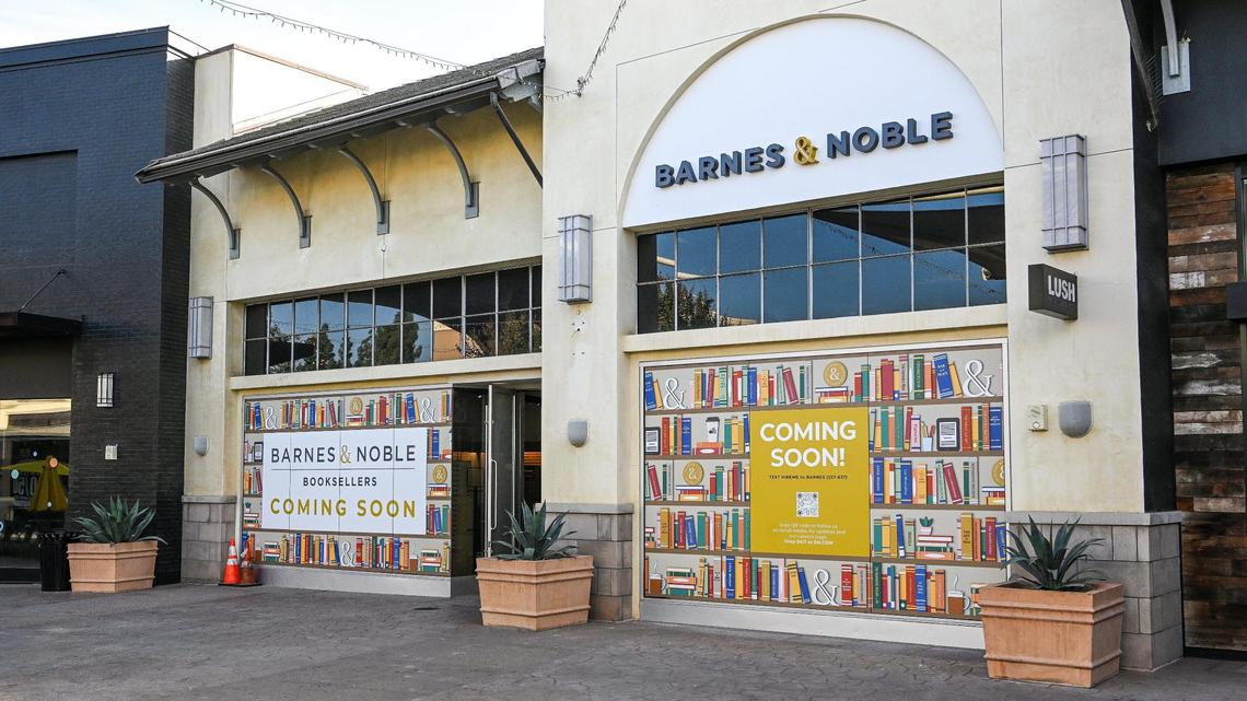 Signs show that a Barnes & Noble bookstore location is opening soon near the main entrance to Fashion Fair mall in Fresno.