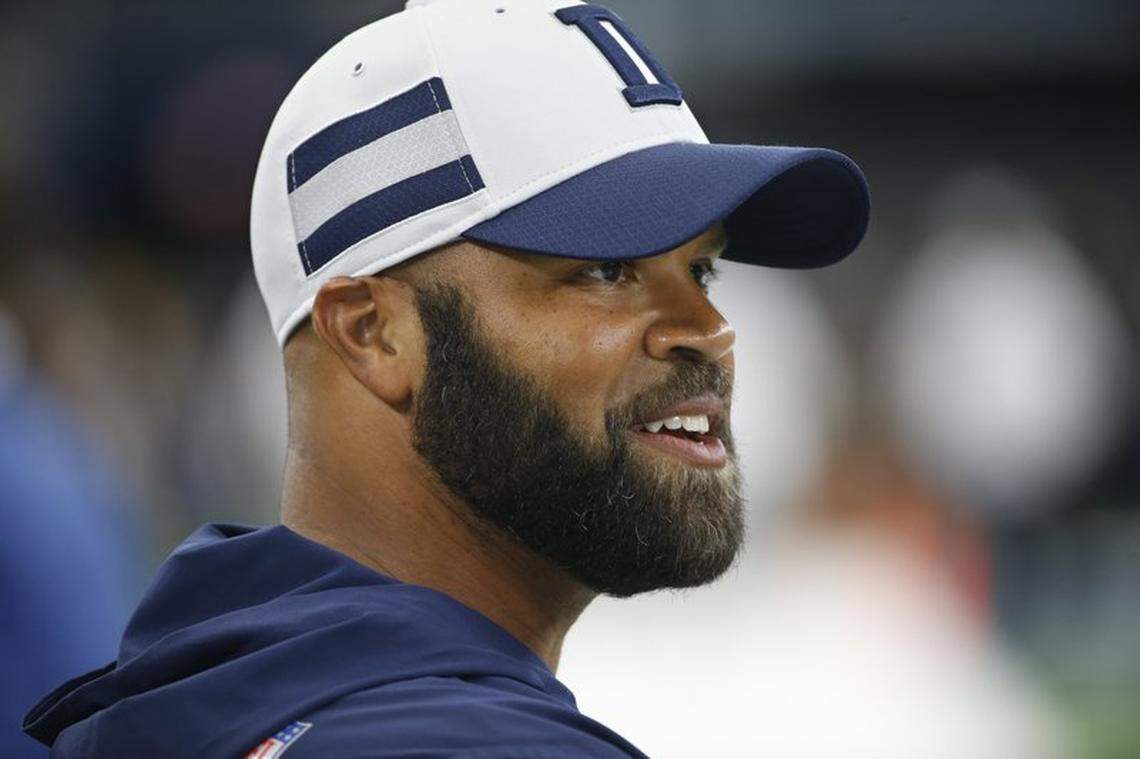 In this Saturday, Aug. 18, 2018, photo, former Dallas Cowboys assistant coach Kris Richard walks on the field before an preseason NFL Football game in Arlington, Texas.