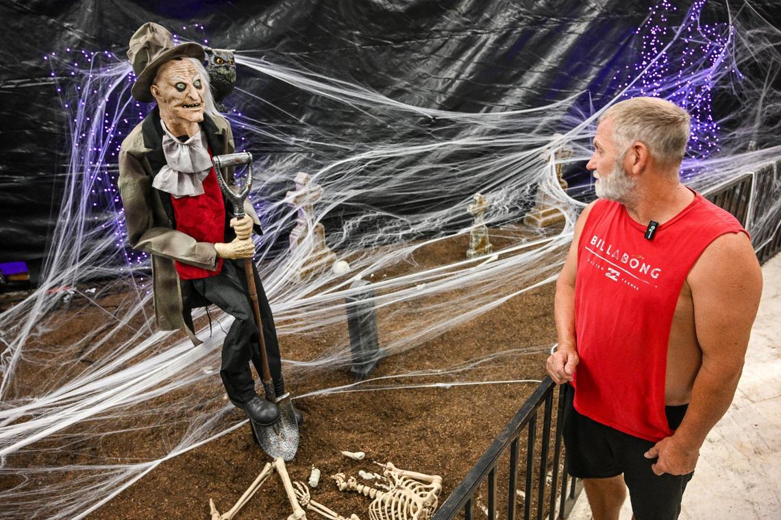 Jason Englebright, one of the partners of the new Scare Factory in Fresno, looks over one of the displays shortly before the attraction is set to open on Friday, Sept. 27, 2024.