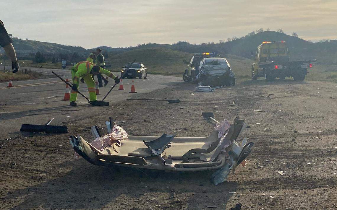 Four men in a silver Hyundai Accent, in the background, were killed in a two-car crash early Saturday, Feb. 5, 2022, on Millerton Road northeast of Fresno. The roof of the second car, a Honda Accord, is in the foreground after it was cut away to rescue two people. A passenger in the Honda was also killed.