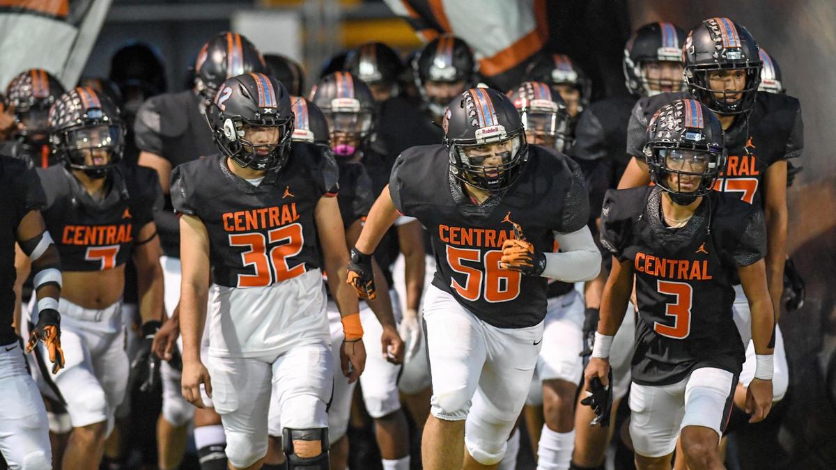 The Central High Grizzlies take to the field before the start of their football game against undefeated Clovis West at Deran Koligian Stadium on Friday, Oct. 21, 2022.