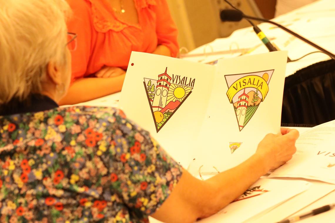 Visalia’s logo redesign committee members work on possible entries recommendations for the city council Monday night at the Visalia Convention Center.