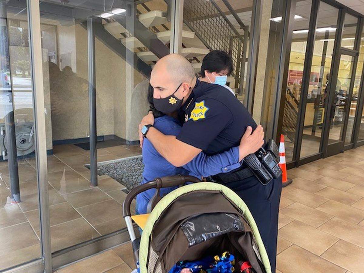 Family of slain street vendor Lorenzo Perez is comforted by Fresno Police Chief Paco Balderrama on Thursday, March 25, 2021, following the arrest of a suspect in the shooting. Perez, 45, a husband and father, was shot “execution style,” police said, as he rode along his route Sunday.