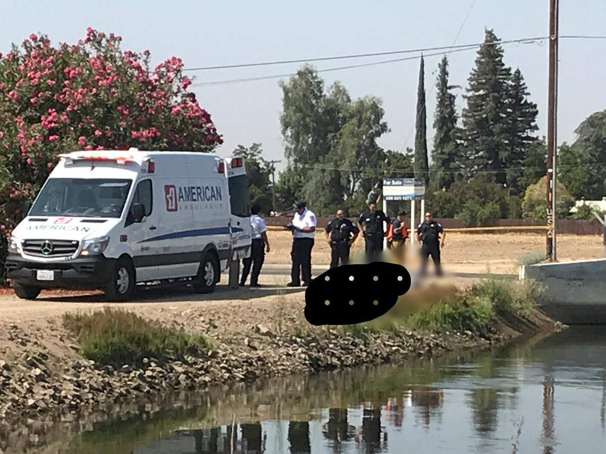 Police arrive at the scene near Hughes and Nielsen avenues where a body was recovered on Wednesday, Sept. 5, 2018.