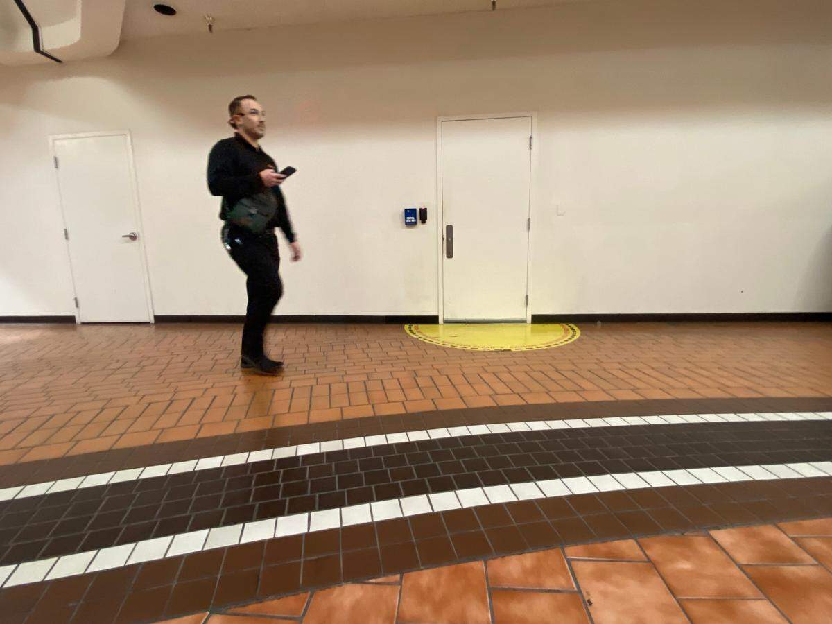 People shuffle pass the DMV call center’s unmarked doorways inside the Manchester Mall in Fresno on Tuesday, Oct. 17, 2023.