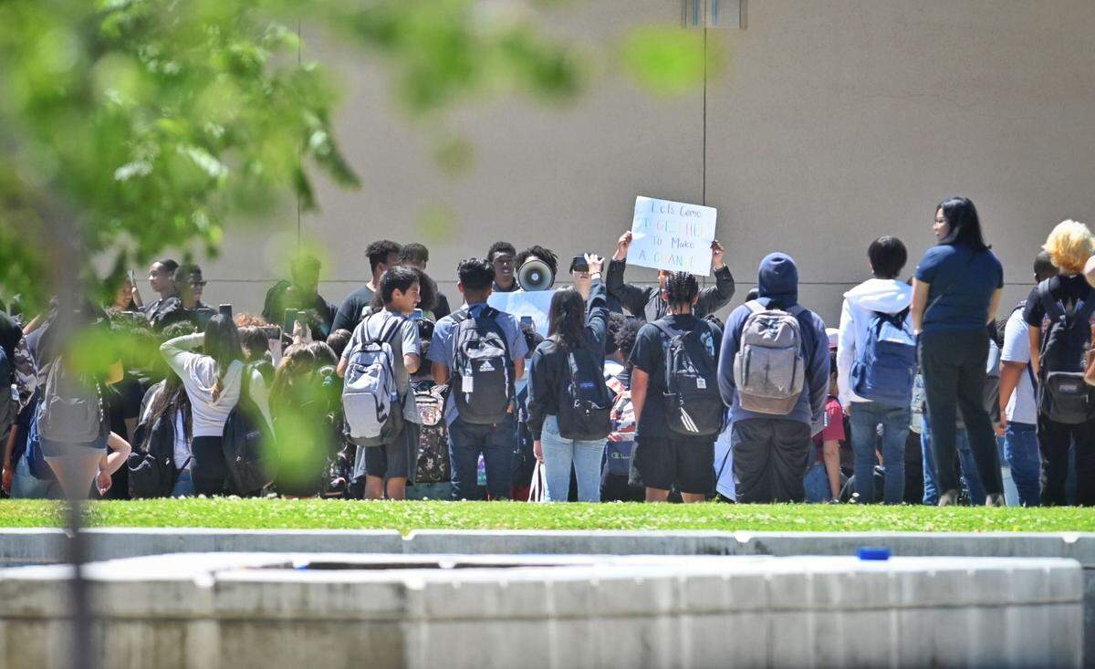 At Bullard High School, several hundred students left class and stood in a quad-area on campus, some waving signs and calling for change.