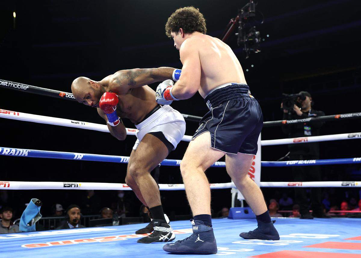Richard Torrez Jr. lands a punch against James Bryant during their heavyweight fight at Desert Diamond Arena on Feb. 3, 2033 in Glendale, Ariz.