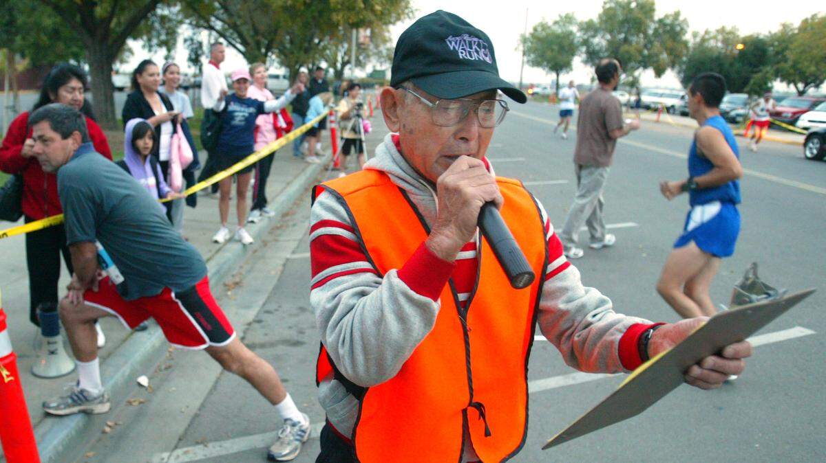 Ken Takeuchi addresses runners during the Komen Race for the Cure at Fresno State on Oct. 27, 2007.