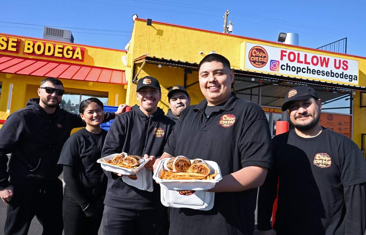 Manager Christopher Pacheco, center, with staff presents chop cheese sandwiches from Chop Cheese Bodega, located on Blackstone Ave. near Bullard Ave., Monday, Jan. 12, 2026. Chop Cheese Bodega has been named a fan favorite.