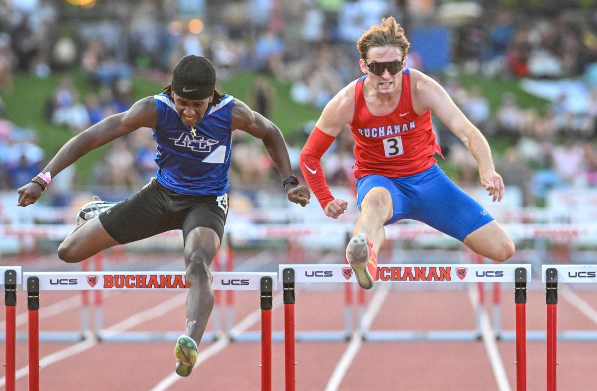 Hudson Hergenrader, right, of Buchanan hits the last hurdle next to Quishawn Stanford of Alta Loma during the CIF state track & field boys 300 meter hurdles at Veterans Memorial Stadium in Clovis on Saturday, May 31, 2025. Hergenrader finished sixth.