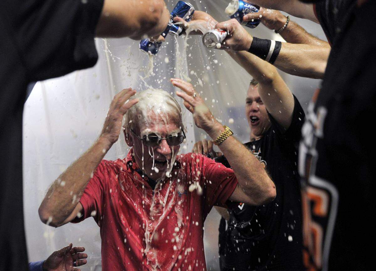 Fresno Grizzlies president Chris Cummings, center, has beer poured over him in the locker room as the Grizzlies celebrate their 7-3 and PCL Championship win against Round Rock Sunday, September 20, 2015 in Fresno, Calif. The Grizzlies won the PCL championship 7-3.