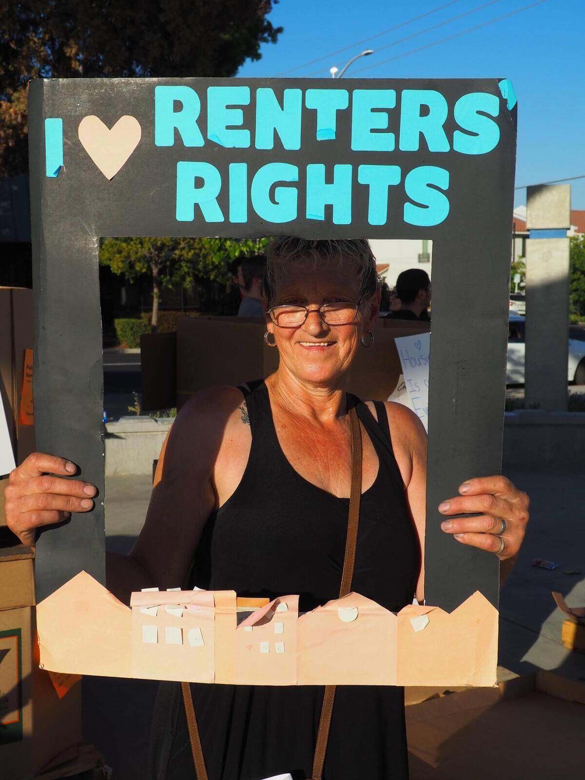 A housing advocates shares her message Wednesday, May 18 during the Fresno Tenants Union kickoff event at the Downtown Fresno Cultural Arts District Park.