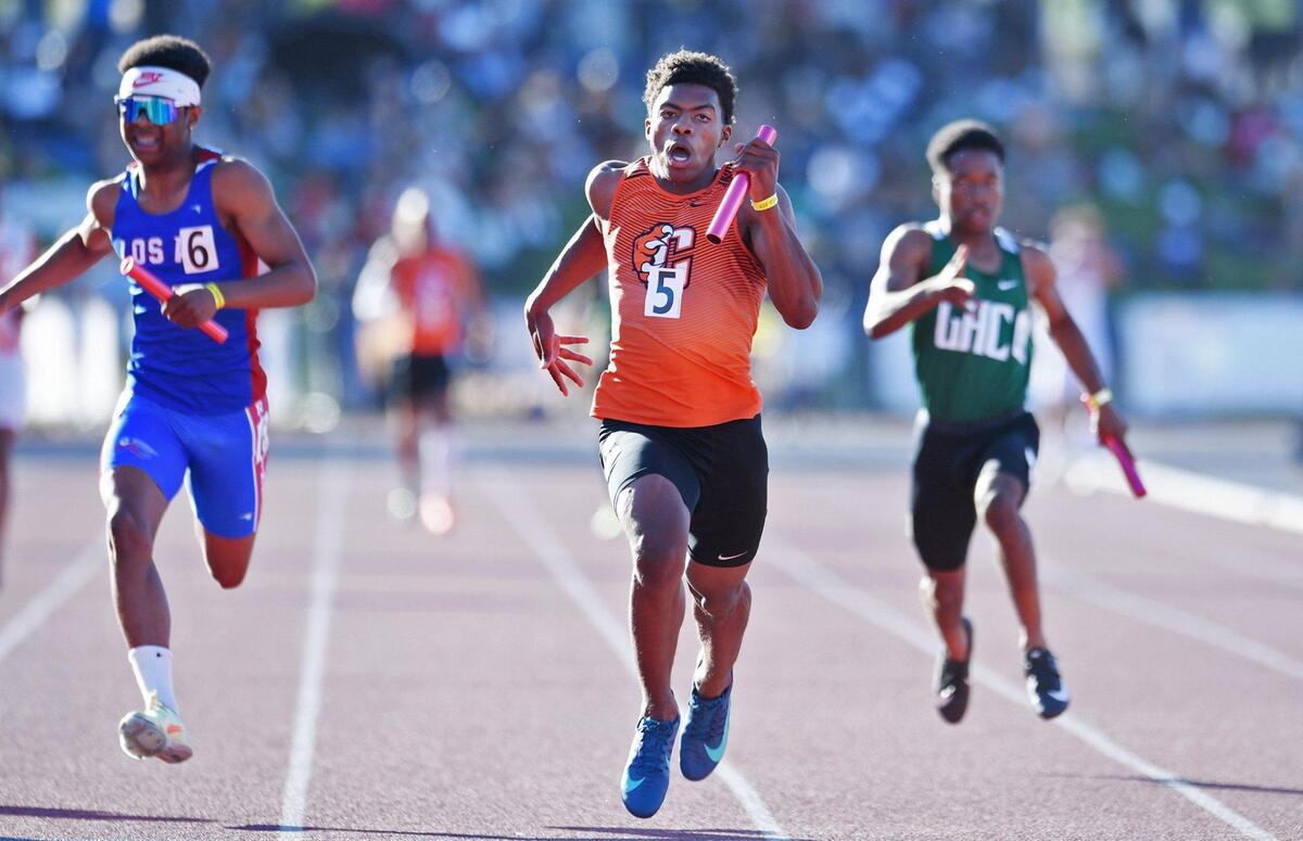 Central’s anchor Imari Conley, center, leads the field placing first in the Boys 400m Relay at the CIF State Track and Field Championship finals Saturday, May 28, 2022 in Clovis.