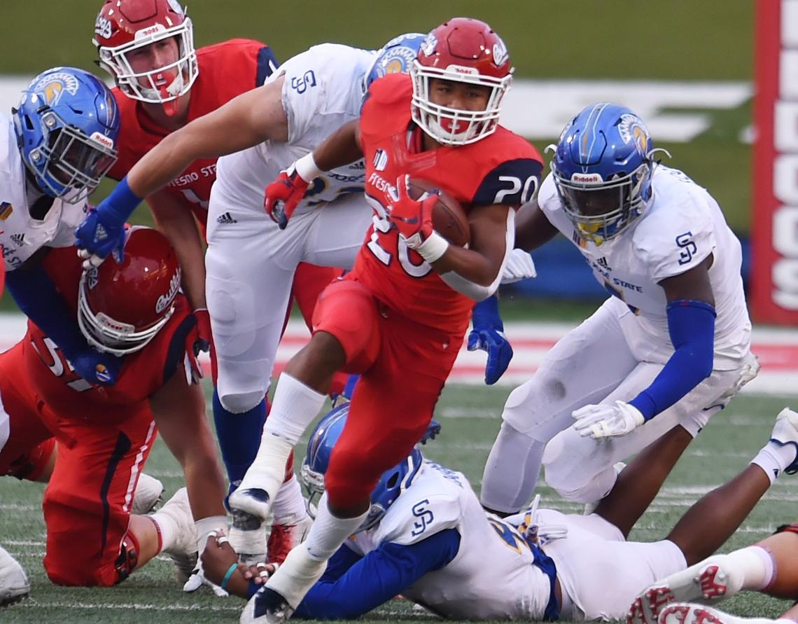 Fresno State running back Ronnie Rivers, center, sprints through a hole in the San Jose State defense in the Bulldogs’ 31-13 victory over the Spartans  Saturday, Nov. 24, 2018 in Fresno. Rivers last season led the Bulldogs in rushing with 743 yards at 5.6 yards per play.