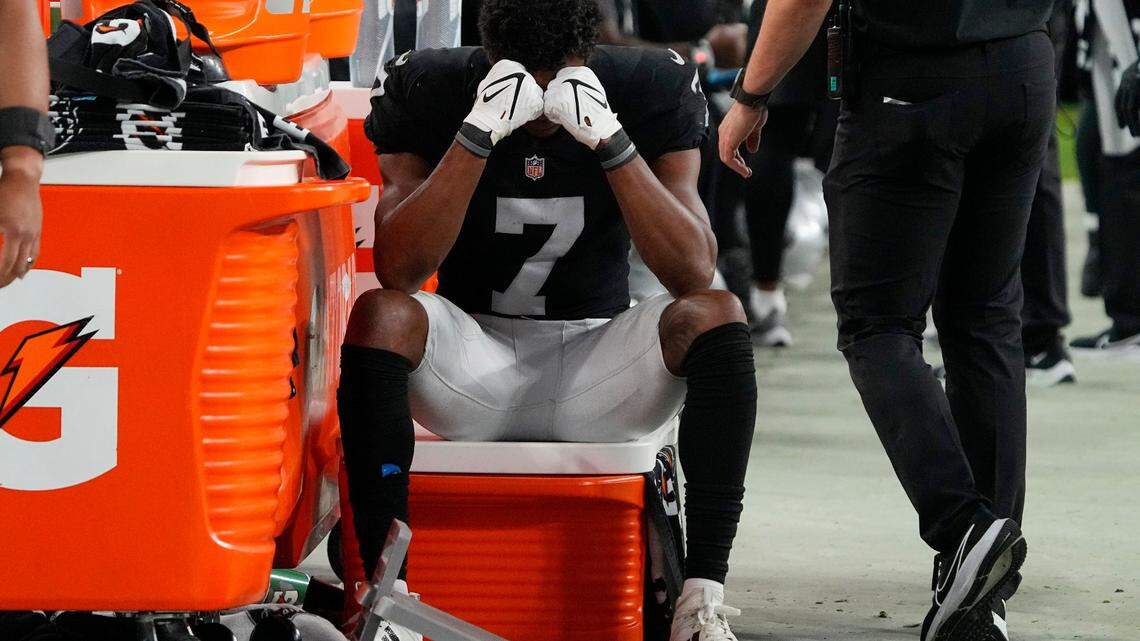 Las Vegas Raiders wide receiver Zay Jones (7) sits on the sidelines with his head in his hands during the second half of an NFL football game against the Kansas City Chiefs, Sunday, Nov. 14, 2021, in Las Vegas.