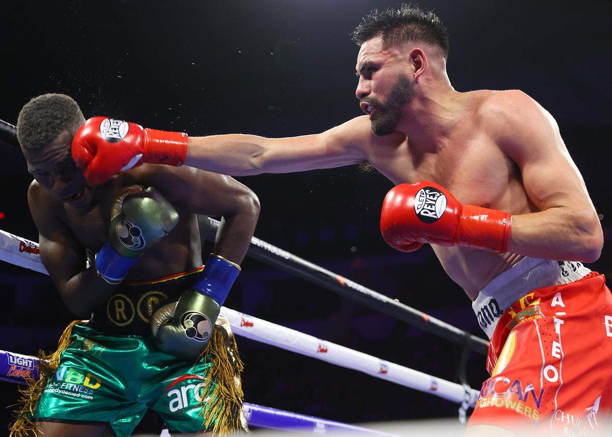 Richard Commey and Jose Ramirez exchange punches during their junior welterweight fight at Save Mart Center on March 25, 2023 in Fresno, California.