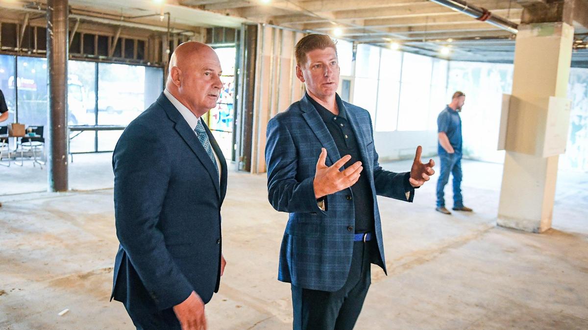 Matthew Dildine, right, CEO of the Fresno Mission, shows Fresno Mayor Jerry Dyer inside the Mission’s City Center facility under construction at the old Sierra Hospital campus in central Fresno following a press conference on Friday, Oct. 22, 2021.