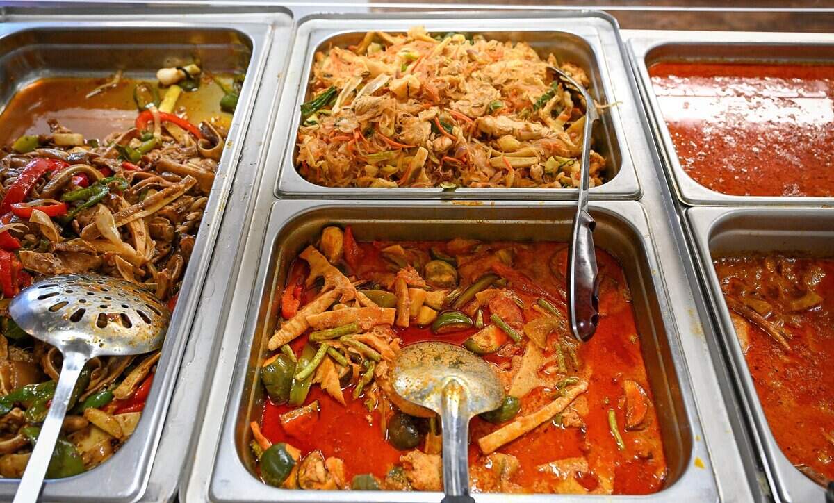 Various dishes are freshly prepared for customers at NyabTee's Kitchen, a new Asian restaurant on First north of Belmont in Fresno. It offers Hmong food but also other Asian influences like Cambodian, Thai and Indian among their dishes.