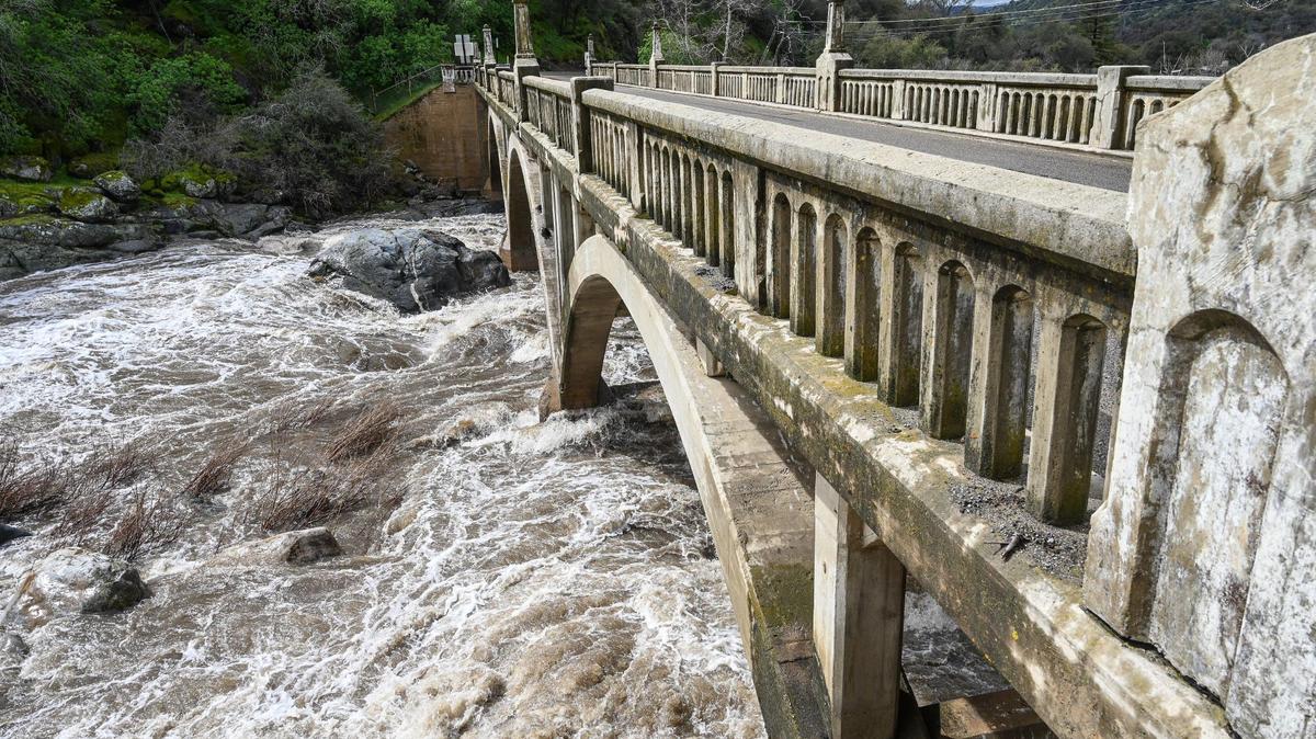 Heavy storm runoff fills the Kaweah River at the Pumpkin Hollow Bridge and the Gateway Restaurant and Lodge on Highway 198 in Three Rivers on Saturday, March 11, 2023.