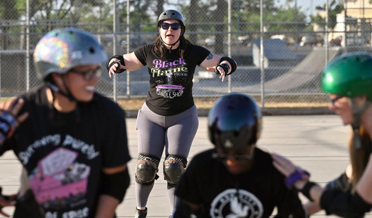 Rebecca “Memento Maureen” Noel, background, leads the Ash City Roller Derby practice at Cary Park on Thursday, May 6, 2025 in Fresno, California.