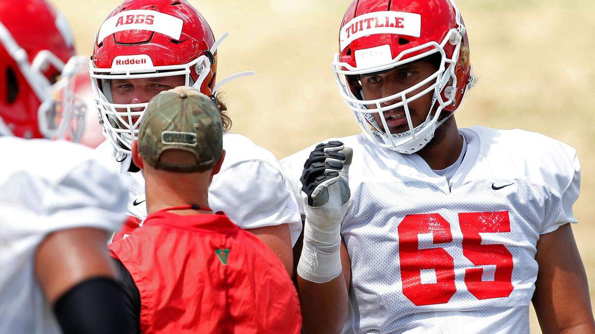 Fresno State right tackle Syrus Tuitele (65) played a large role in the success of the Bulldogs’ run game last season. The Bulldogs averaged 180.5 yards per game on the ground in the games he started, just 116.8 after he suffered a season-ending injury.