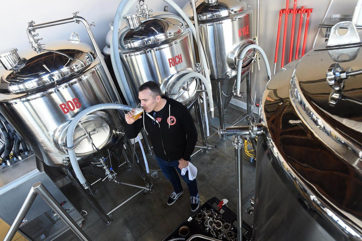 South of Shaw Brewing Company co-owner and brewmaster Dana Pellrin samples the product. South of Shaw Brewing Company has opened in the renovated 1920’s industrial building where Peerless Pumps once operated, at Amador and Broadway streets. The name is a throwback to a time when Fresno’s downtown thrived a hundred years ago, and in recognition to its comeback through revitalization, according to co-owner Douglas Dart.